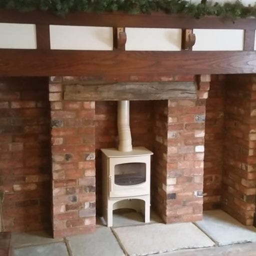 Log-burner-installed-in-brick-built-feature-fireplace